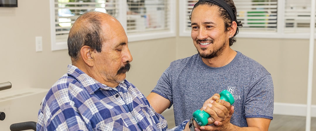Therapist helping a senior with rehabilitation